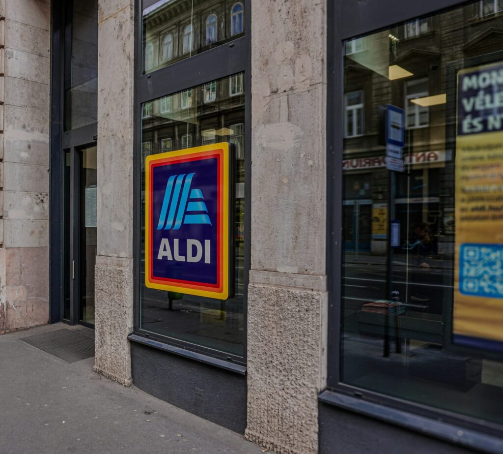 Aldi store logo displayed on a glass window of the new store format in the us. 