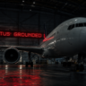 Grounded commercial plane showing the visual impact of sudden airline bankruptcies on holiday travel plans.