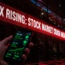Red VIX ticker flashing a stock market crash warning, aiding options trading strategy decisions.